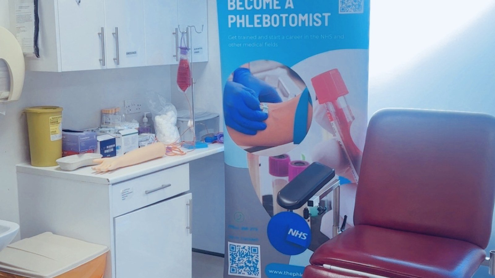 Student practising venepuncture on a training mannequin
